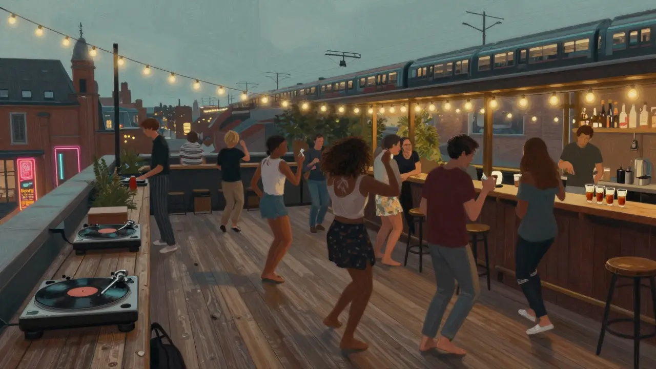 People dancing barefoot on a wooden rooftop deck with string lights and vinyl records.